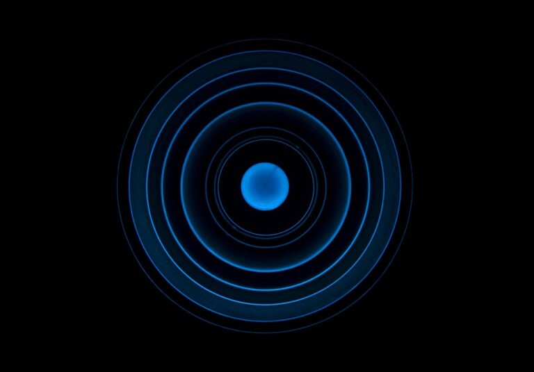 Abstract blue concentric circle pattern on a black background, ideal for futuristic designs.